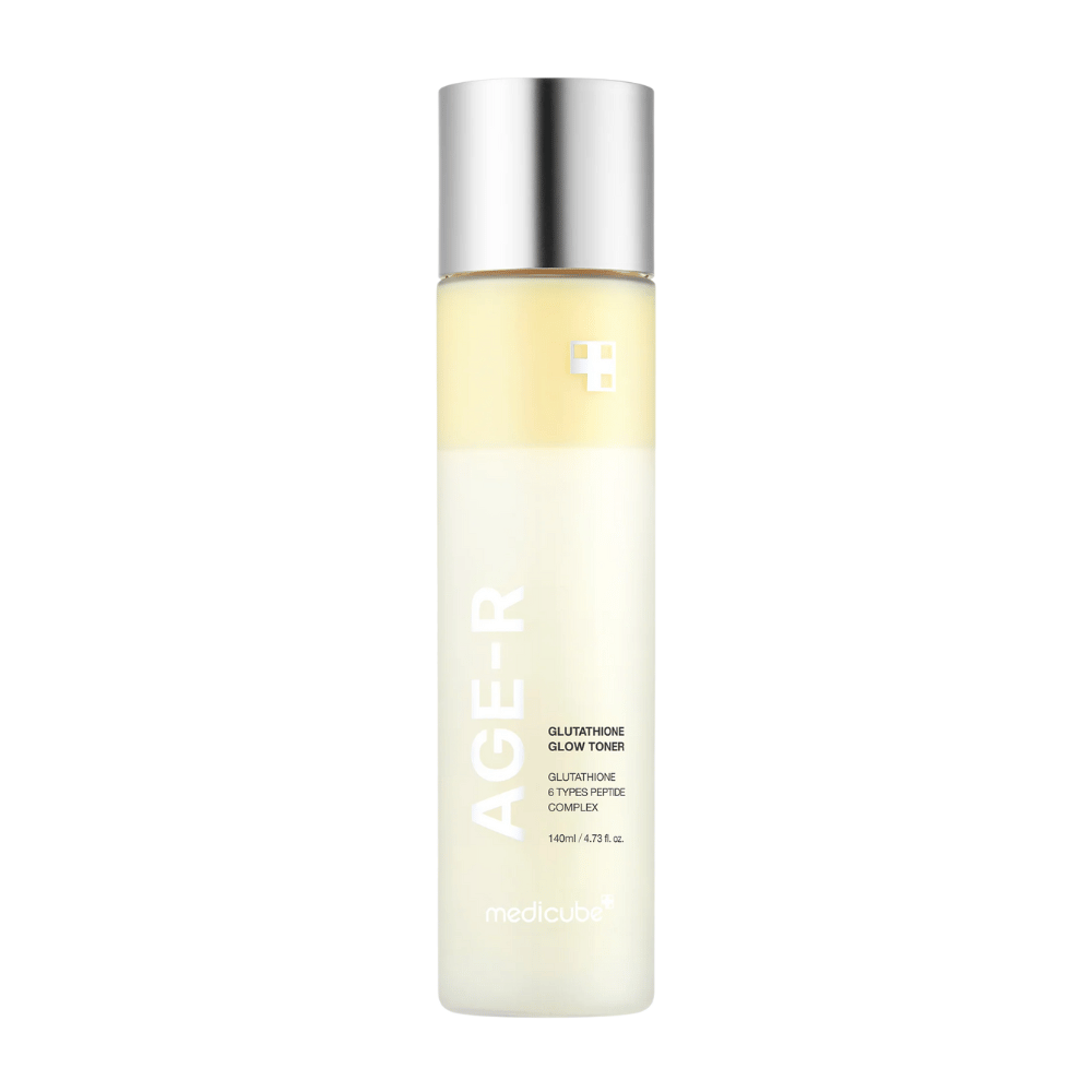 Bottle of Medicube Age-R Glutathione Glow Toner, a light yellow toner containing glutathione and a peptide complex. The product is designed to give the skin long-lasting radiance and even skin tone. The bottle has an elegant, minimalist design with a silver-colored cap.