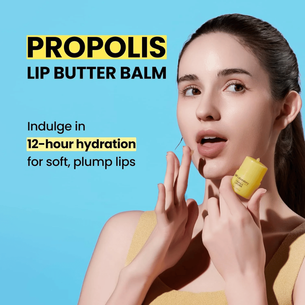 A woman applies CNP Laboratory Propolis Lip Butter Balm, highlighted against a blue background. The product promises 12 hours of hydration for soft and plump lips, demonstrated with a yellow tube she holds in her hand.