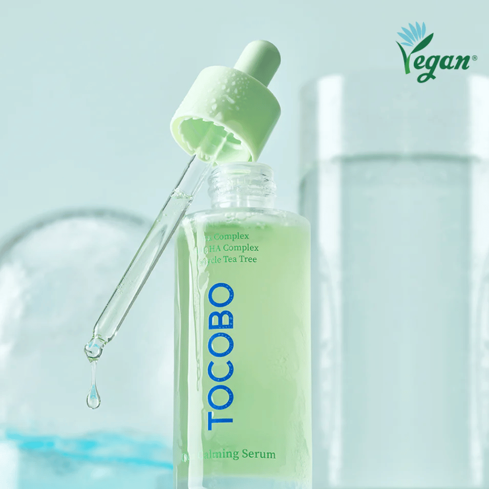 Close-up of TOCOBO Cica Calming Serum with pipette and drops, moisturizing and soothing face serum with cica, multi HA-complex, and tea tree for sensitive skin.