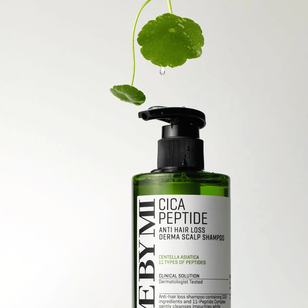 Bottle with SOME BY MI Cica Peptide Anti Hair Loss Derma Scalp Shampoo in green with black pump and white label, surrounded by centella leaves and a water drop.