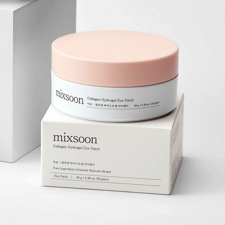 Image of Mixsoon Collagen Hydrogel Eye Patch. The jar is pink and white and contains 84 g of collagen eye patches. It is placed on a white box with text describing the product and its contents. The design is sleek and modern, perfect for eye care.