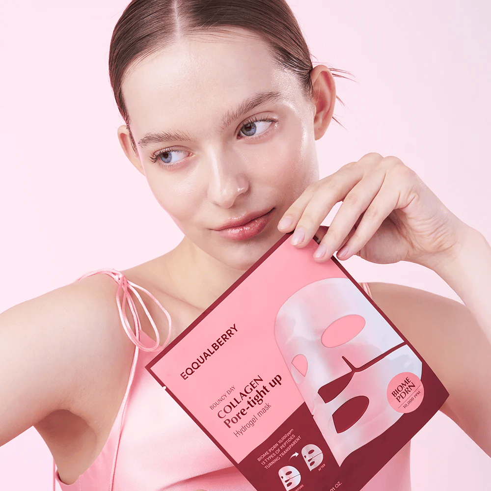 A woman holds a package with the face mask Collagen Pore-tight Up Hydrogel Mask in front of her, while looking to the side with natural, fresh skin.