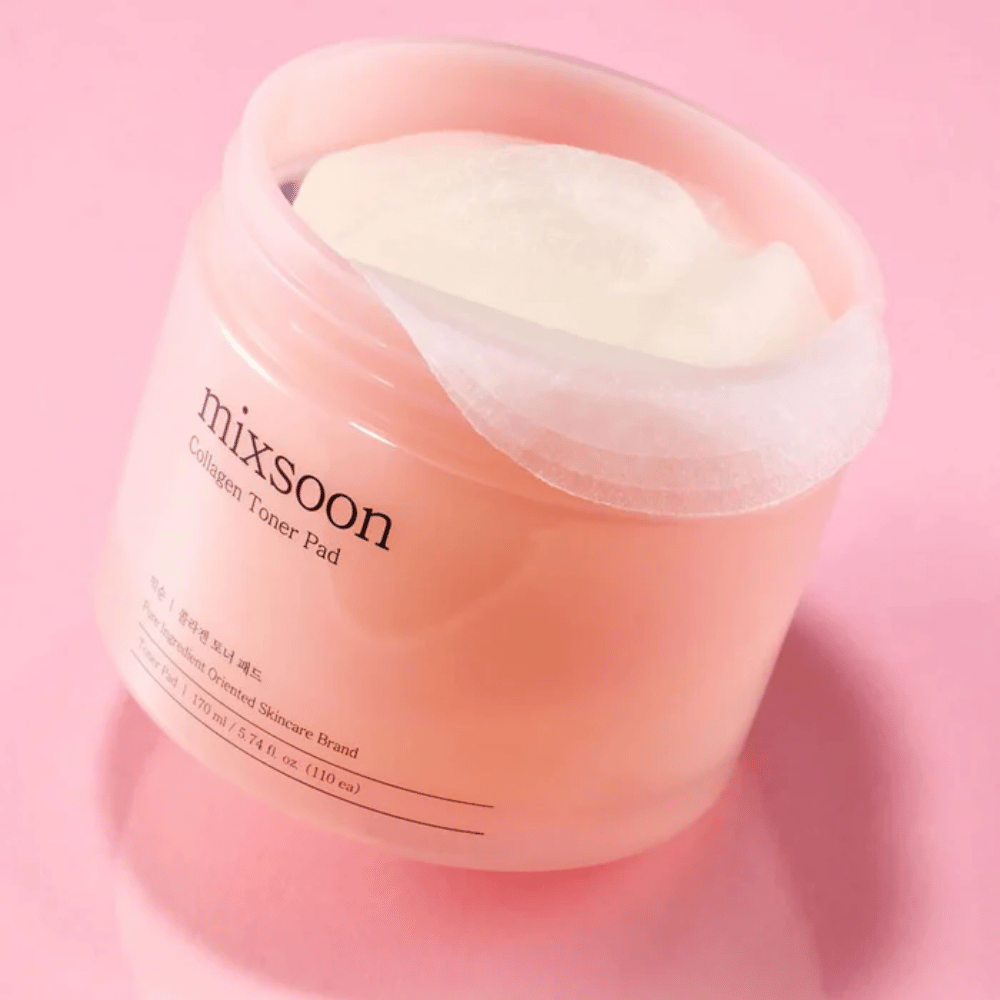 Mixsoon Collagen Toner Pad with 110 pads in a pink jar, photographed against a pink background.