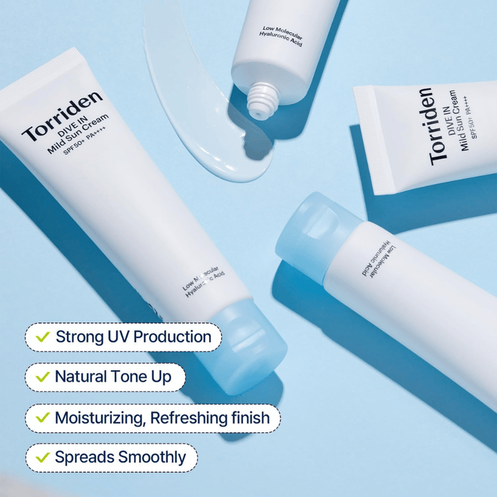 Several tubes of Torriden DIVE-IN Mild Sun Cream are scattered across a blue background with a little product smeared out. Text highlights benefits such as UV protection, hydration, and even application.
