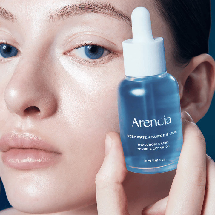 Model applies Arencia Deep Water Surge Serum – hydrating Korean serum with hyaluronic acid, PDRN and ceramides that soothe sensitive skin and strengthen the skin barrier.