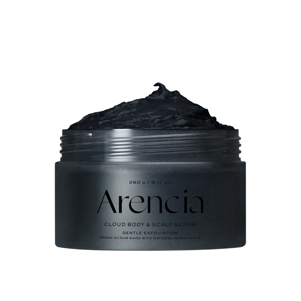 Arencia Cloud Body & Scalp Scrub with black exfoliating texture in an open jar, body scrub and scalp scrub that gently exfoliates and cleanses.