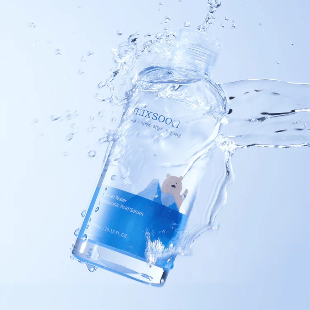 Mixsoon Glacier Water Hyaluronic Acid Serum bottle with a blue label and polar bear motif surrounded by splashing water against a light blue background.