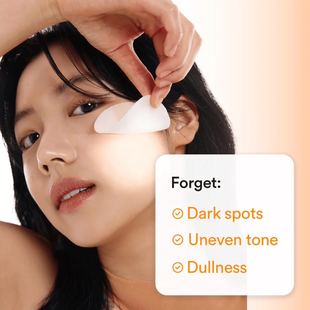 Woman applying a toner pad under the eye to counteract dark spots and dull skin.