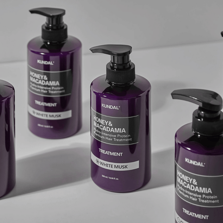 KUNDAL Honey & Macadamia Hydro-Intensive Protein Premium Hair Treatment White Musk, 500 ml, i lila pumpflaska.