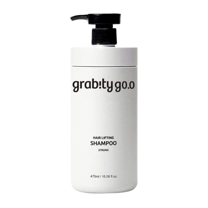 Grabity g0.0 Hair Lifting Shampoo Strong in a sleek white pump bottle on a white background, developed to provide volume, strength, and a fuller hair appearance.