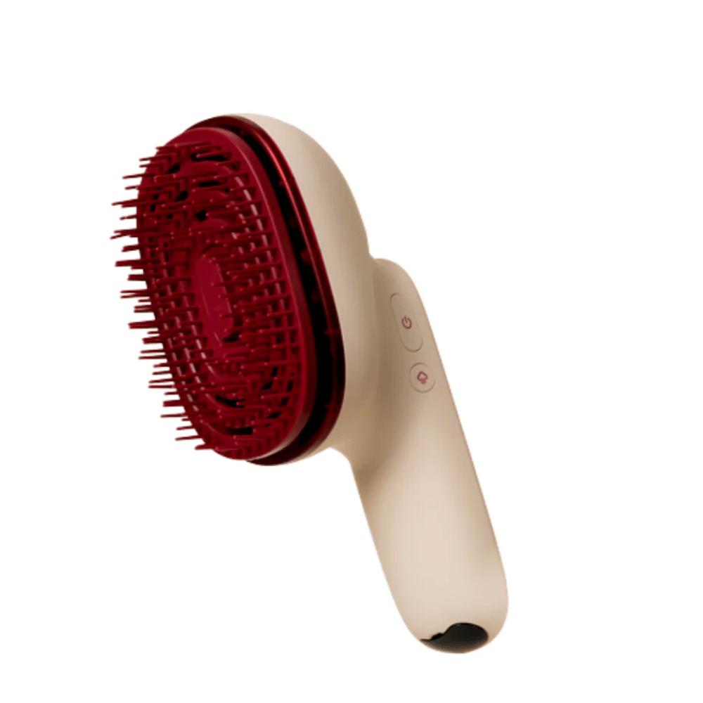 Close-up of MOEV Hair Steamer Pro with red bristles and ergonomic handle. Professional hair care brush with steam and LED technology.