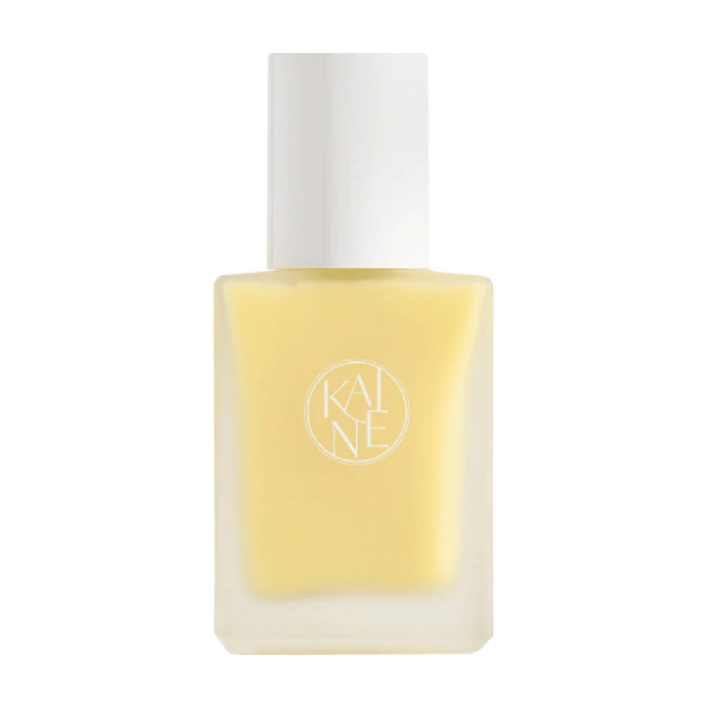 A yellow Vita Drop Serum 30ml bottle on a white background with KAINE skincare products.