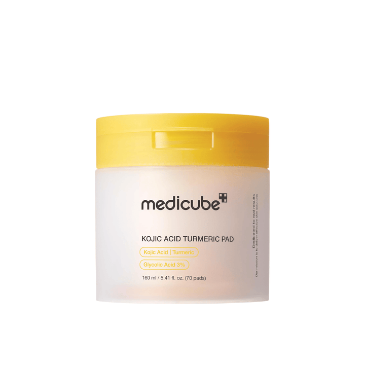 Cutout product image of Medicube Kojic Acid Turmeric Pad in a yellow jar with exfoliating pads containing kojic acid, turmeric, and glycolic acid for a more even skin tone and glow.