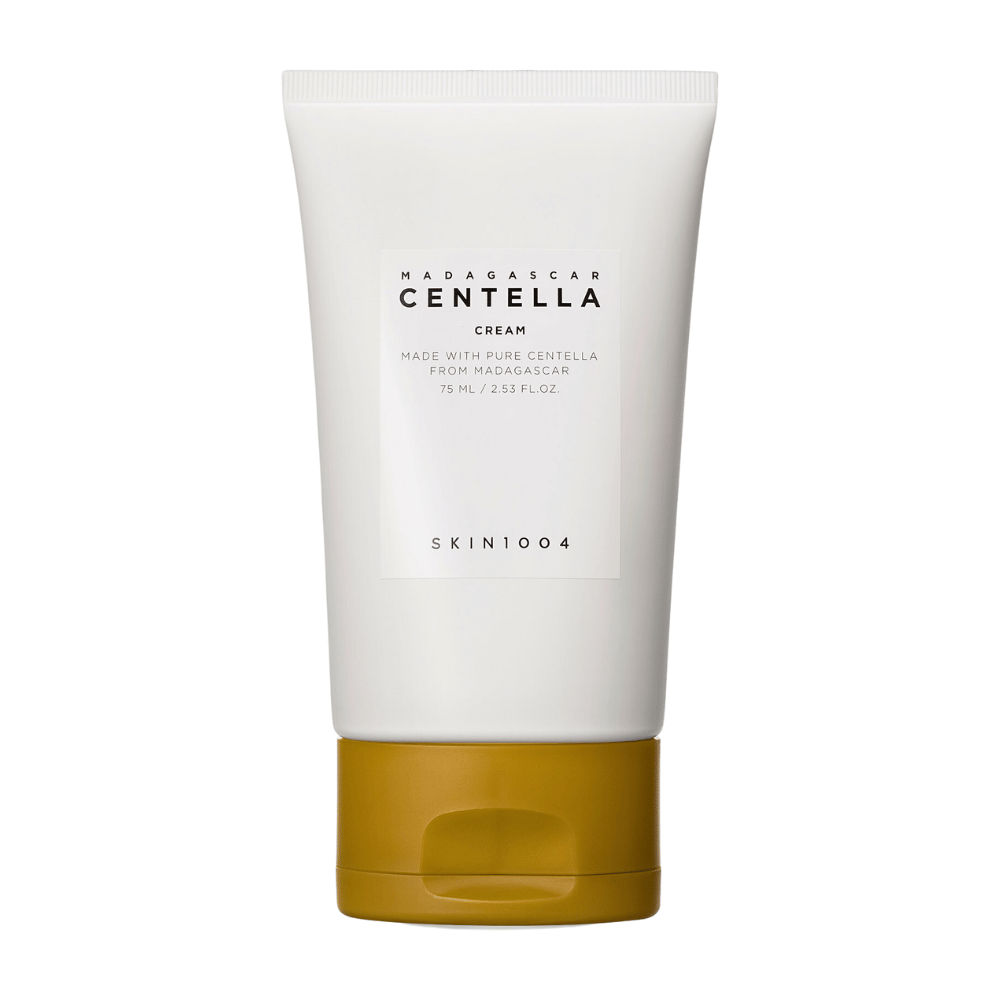 The image shows a tube of "Madagascar Centella Cream" from SKIN1004. It is a skin cream made from pure Centella from Madagascar and comes in a package of 75 ml / 2.53 fl.oz. The product is intended to be used for skincare, to provide nourishment and moisture to the skin.