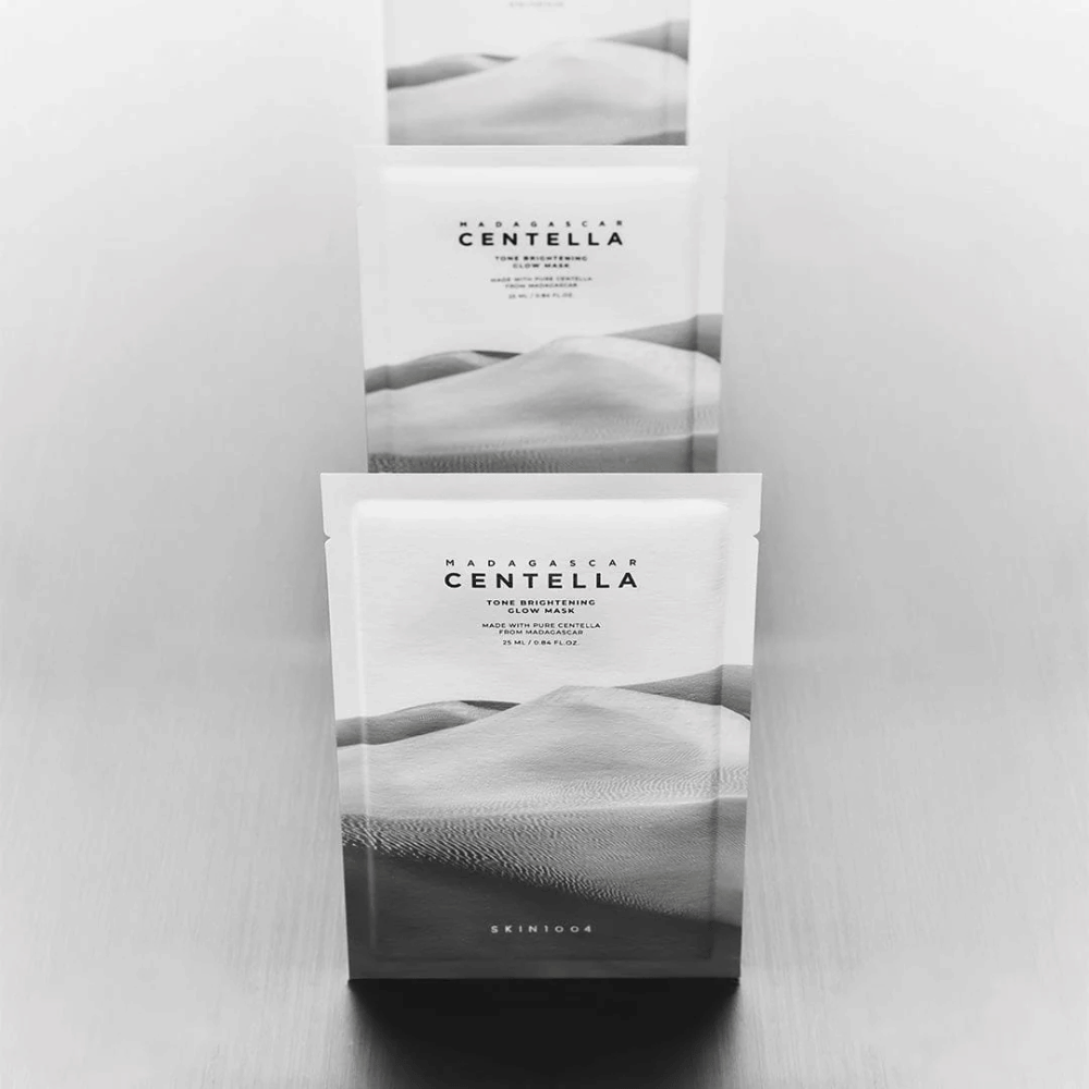 Several masks stacked in a row, sleek product presentation in black and white.
