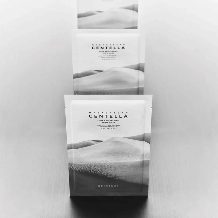 Several masks stacked in a row, sleek product presentation in black and white.