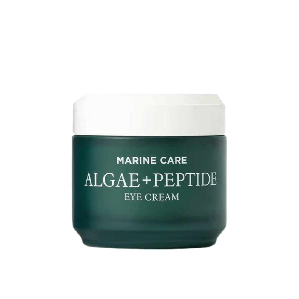Heimish Marine Care Algae + Peptide Eye Cream in a dark green jar with a white lid. An eye cream enriched with algae and peptides to moisturize, brighten, and reduce fine lines around the eyes.