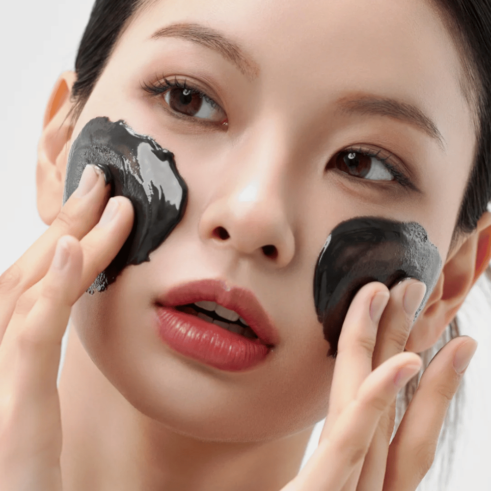 Close-up of applying How Midnight Soothing Cleansing Balm on the face. Soft cleansing balm that dissolves impurities and gives a calm skin feeling.