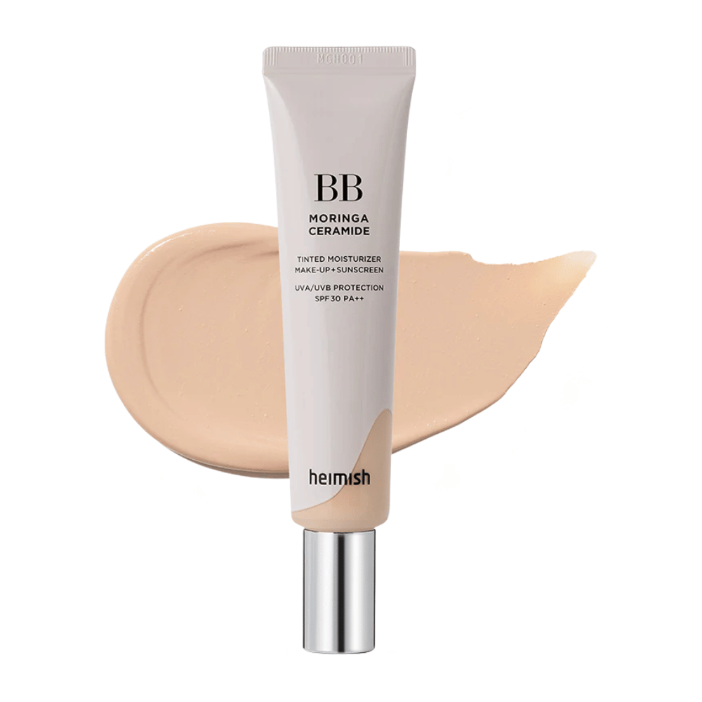 Product image of Heimish Moringa Ceramide BB Cream in front of a light shade swatch. The image focuses on a lighter shade and shows the soft, natural finish that the BB cream gives the skin.