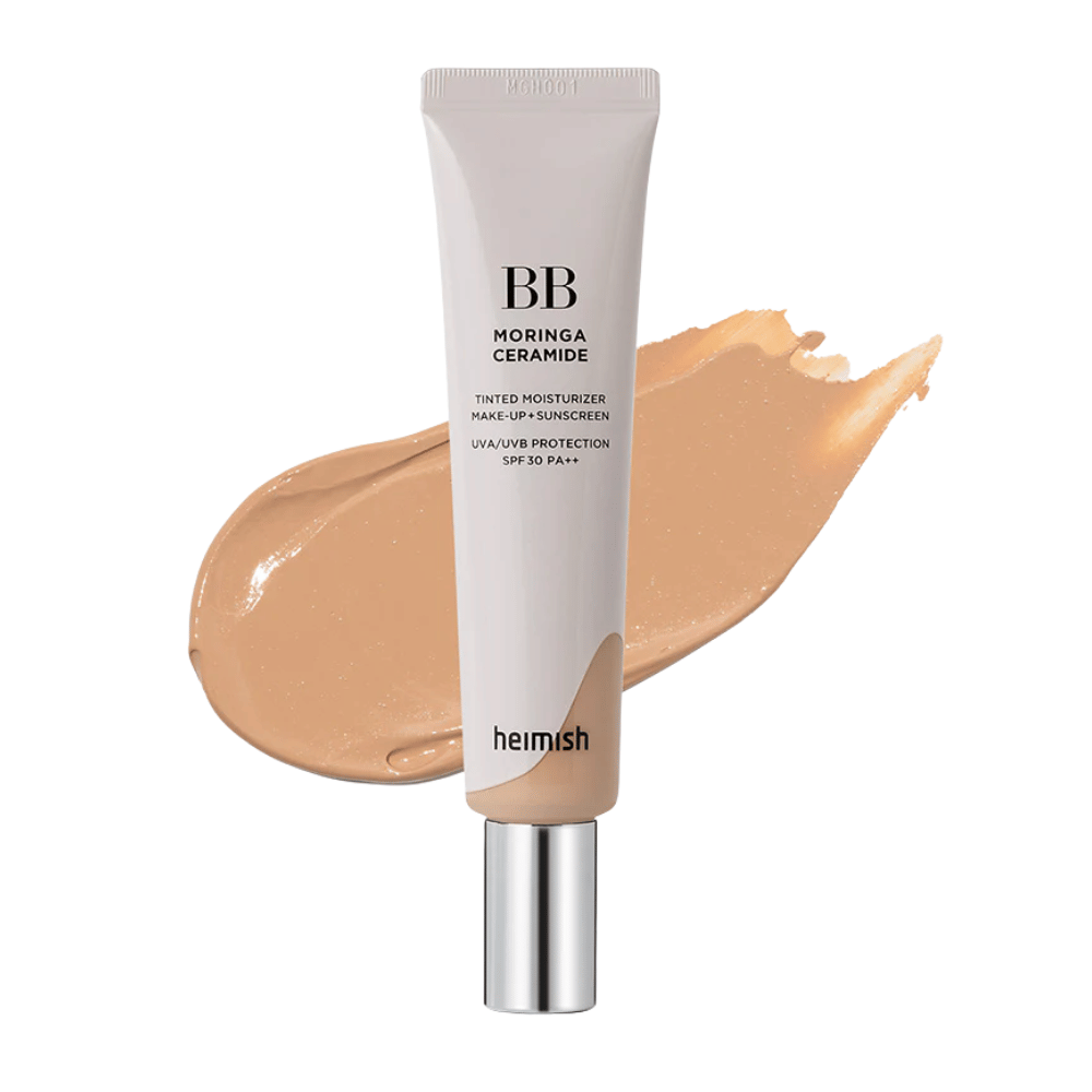 Product image of Heimish Moringa Ceramide BB Cream in front of a swipe of beige BB cream. The image highlights a medium-dark shade as well as the product's moisturizing and smoothing properties.