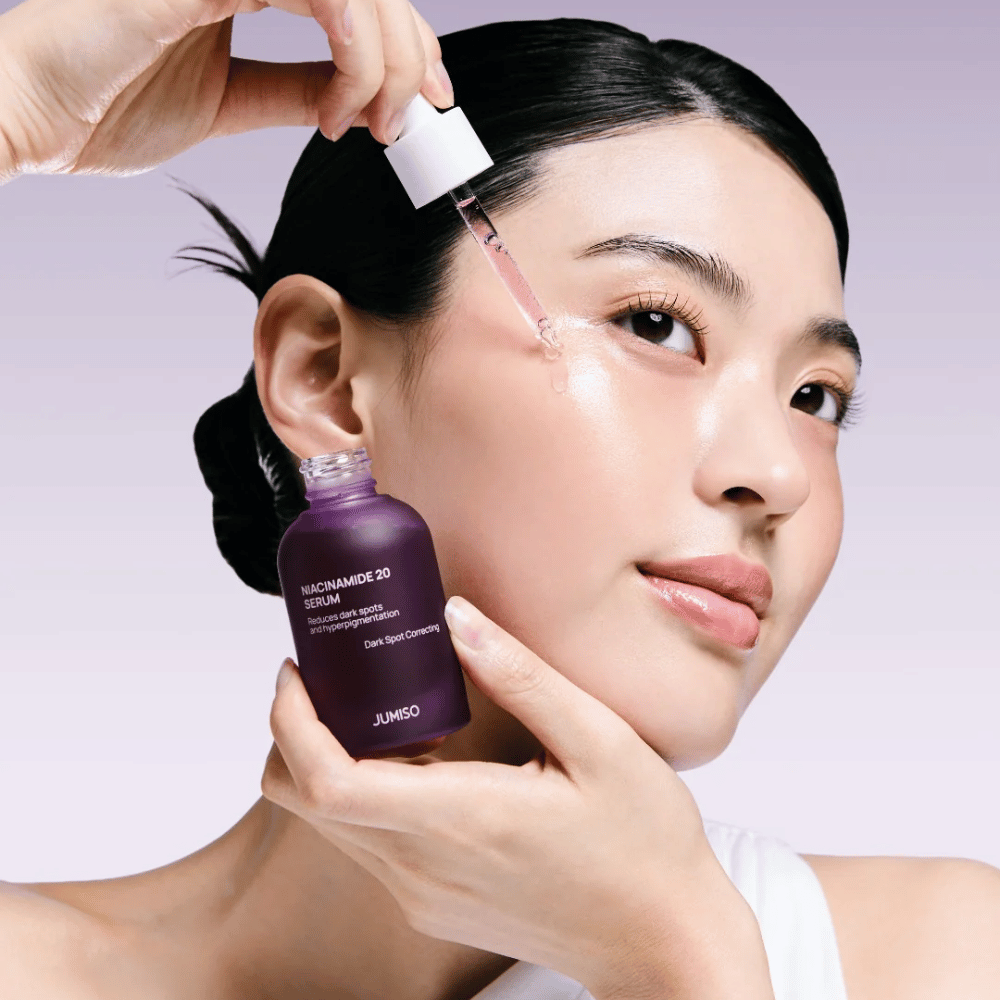 Woman applies Jumiso Niacinamide 20 Serum – radiance-boosting Korean serum that evens out skin tone and reduces pigmentation spots.