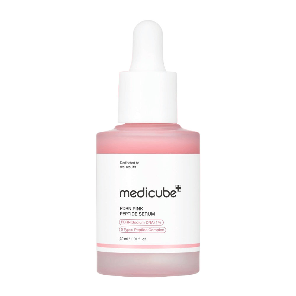 Medicube PDRN Pink Peptide Serum 30 ml, pink facial serum with 1% PDRN and peptides in a glass bottle with a white dropper against a white background.