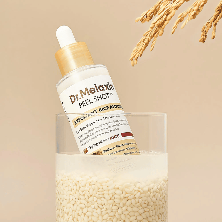 Dr.Melaxin Peel Shot Exfoliant Rice Ampoule placed in a glass with rice, illustrating the glow-enhancing and moisturizing properties of rice extract in Korean skincare.