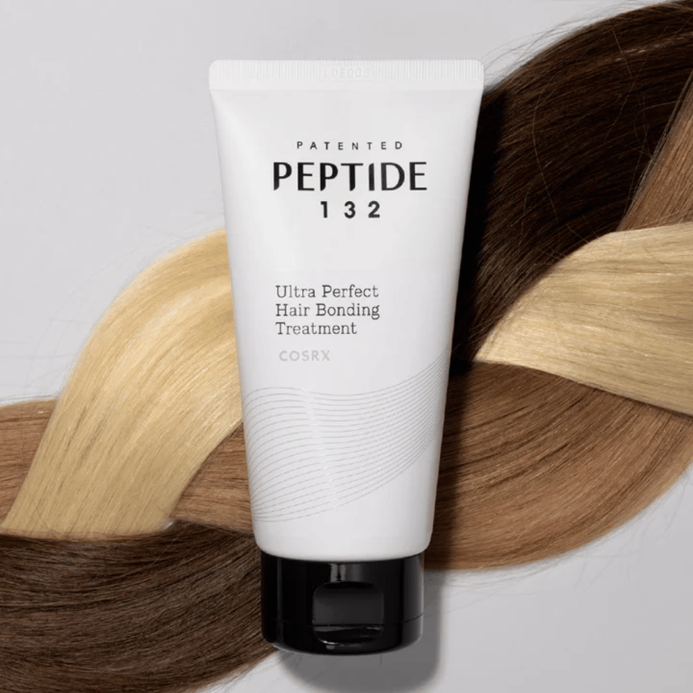 COSRX Peptide 132 Ultra Perfect Hair Bonding Treatment placed against braided hair in different shades – symbolizes repairing and strengthening effect.