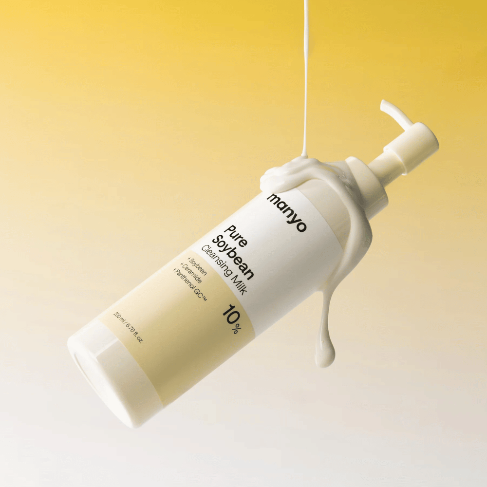 2. Ma:nyo Pure Soybean Cleansing Milk – moisturizing face wash with a creamy texture against a yellow background