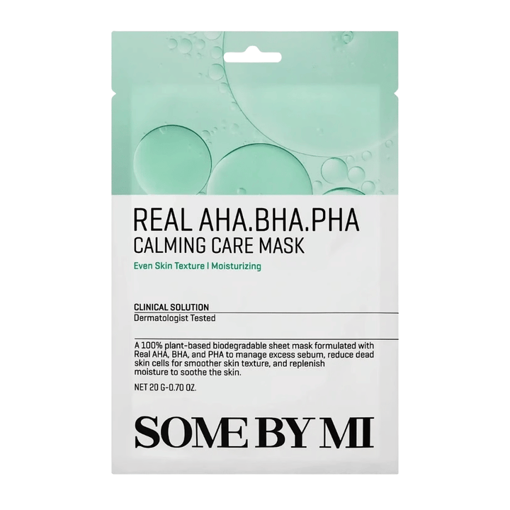 Clean product image of SOME BY MI Real AHA.BHA.PHA Calming Care Mask against a white background. The packaging shows the product's main ingredients, AHA, BHA, and PHA, as well as its purpose of exfoliating the skin, reducing excess sebum, and helping to create softer and more hydrated skin. The design features green tones that convey freshness and caring properties.