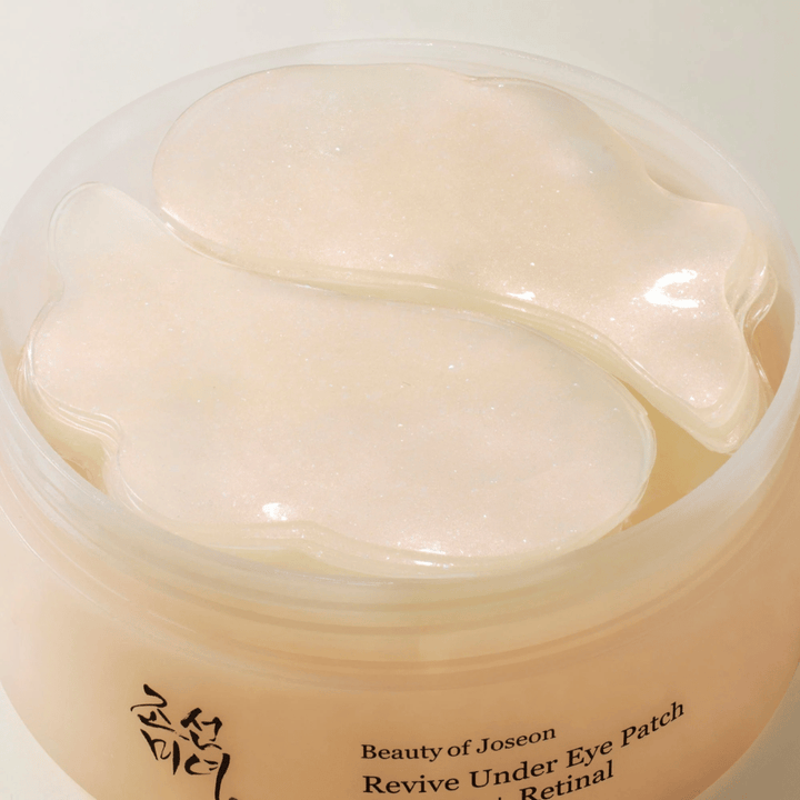 Overview of Beauty of Joseon Revive Under Eye Patch in jar with multiple gel patches, Korean eye care for dryness, fine lines, and tired skin around the eyes.