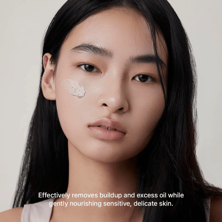 Model with Arencia Rice + LHA Pore Control Rice Cake Cleanser applied on the cheek, mild face wash that effectively removes dirt and excess sebum without drying out the skin.
