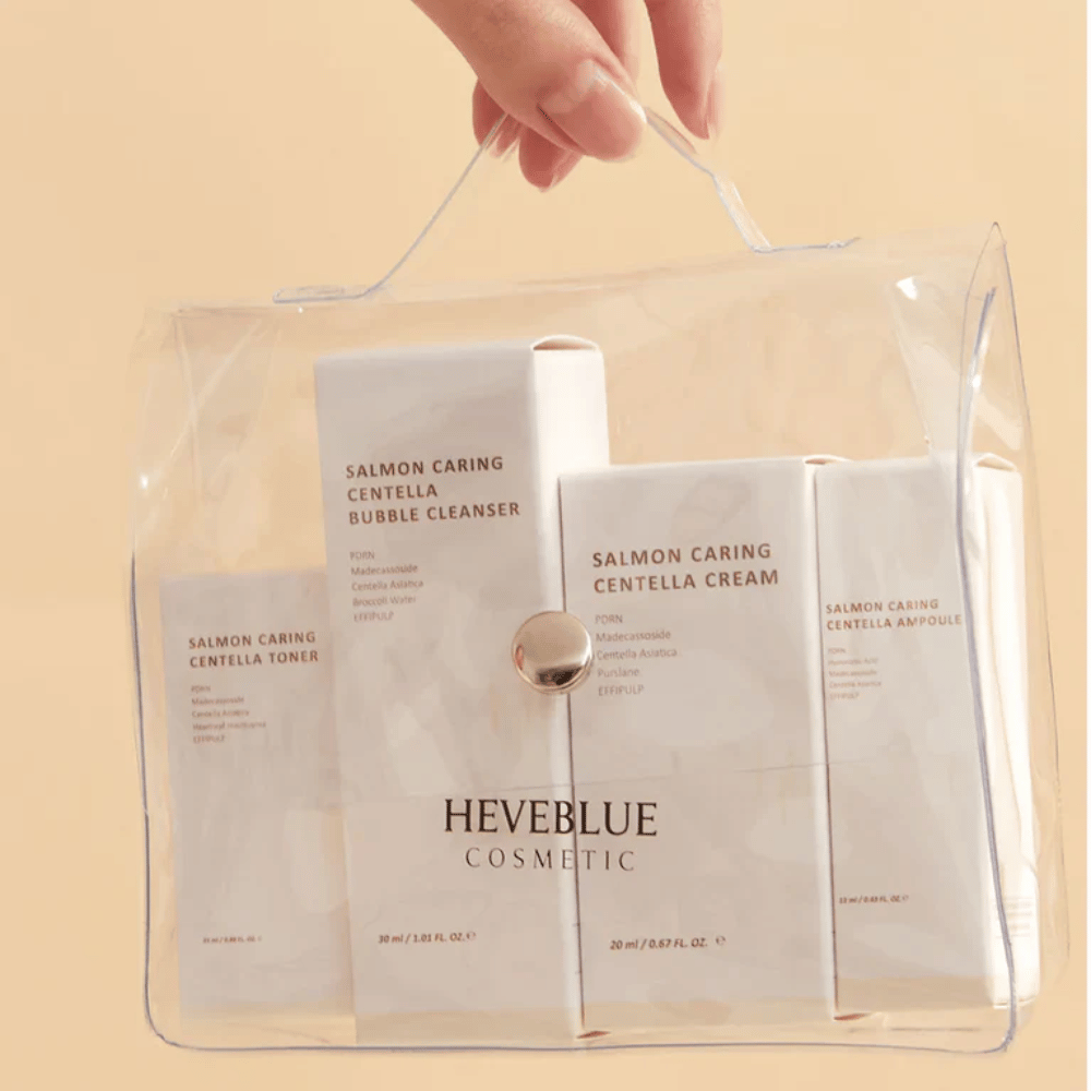 Heveblue Salmon Caring Centella Special Travel Kit toiletry bag – complete Korean skincare set with toner, cleanser, cream, and ampoule in a transparent travel bag.
