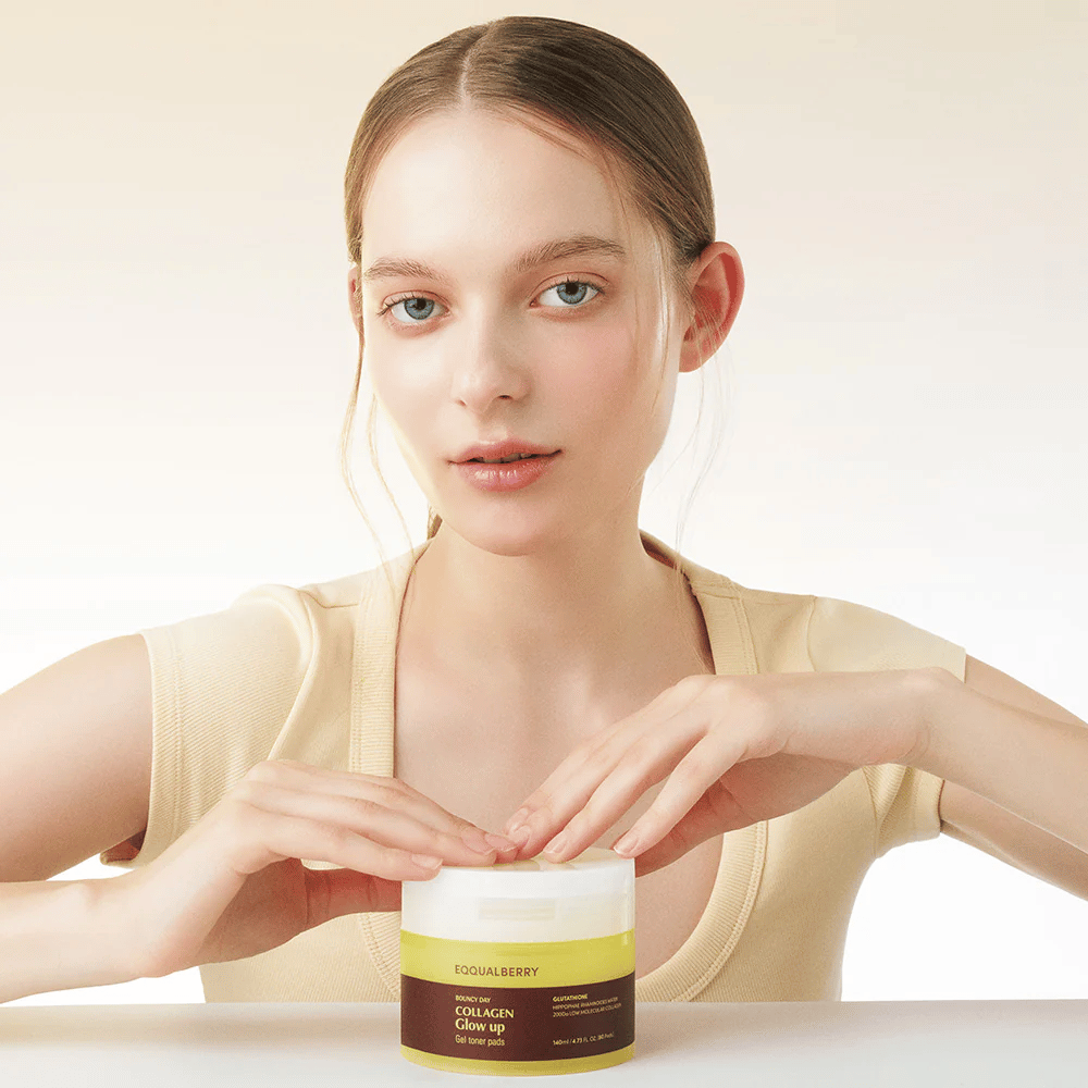 Model holding Bouncy Day Collagen Glow up Gel Toner Pads, which moisturizes and gives a beautiful glow with low molecular collagen and glutathione.