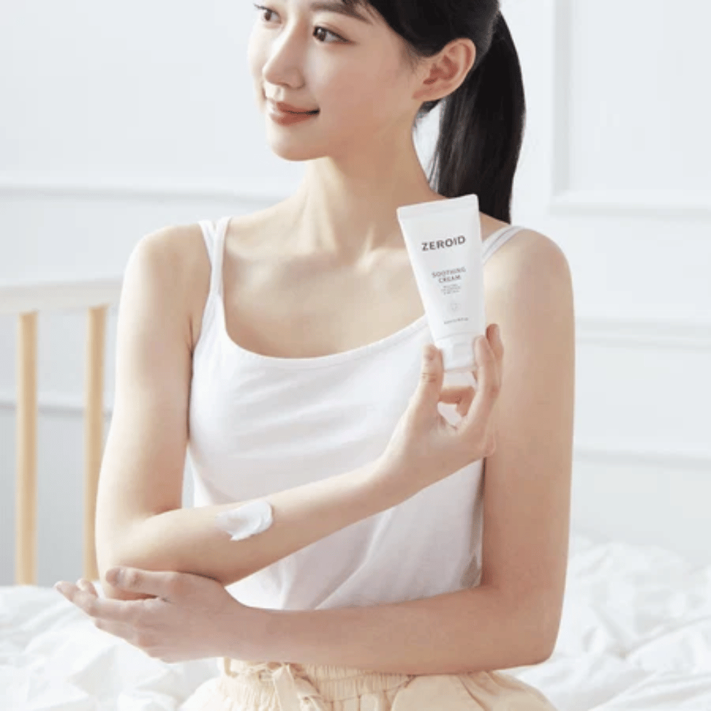 Person applies ZEROID Soothing Cream on the arm to soothe dry and sensitive skin