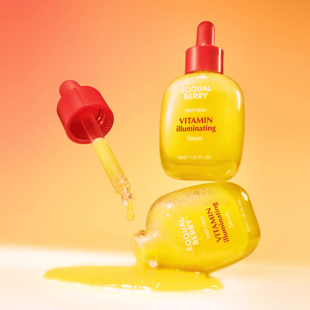 Equal Berry Vitamin Illuminating Serum in a bright yellow bottle with a red pipette. Liquid texture and energetic background create a vibrant and fresh feeling.
