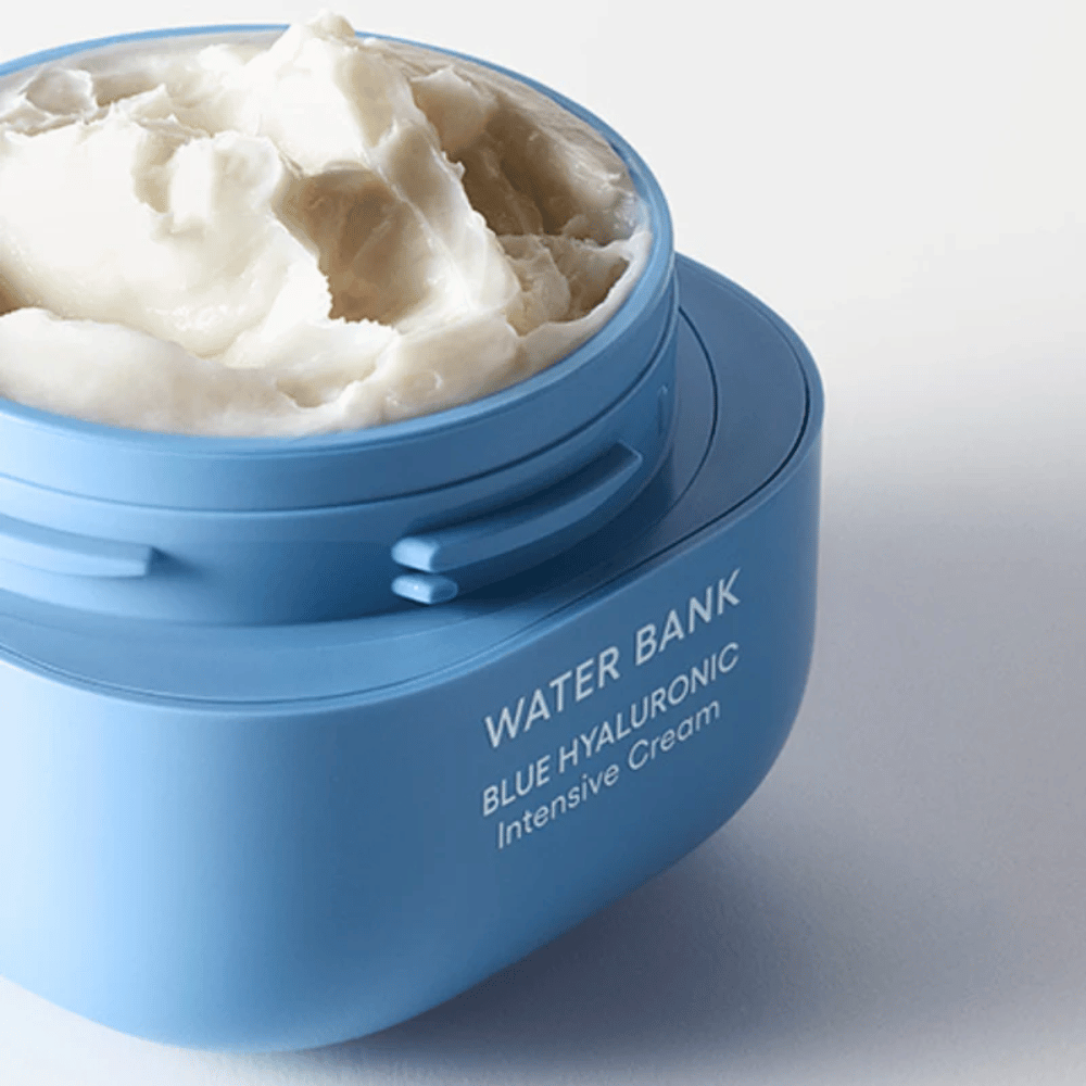 Open jar of LANEIGE Water Bank Blue Hyaluronic Intensive Cream showing the rich creamy texture, against a light background.
