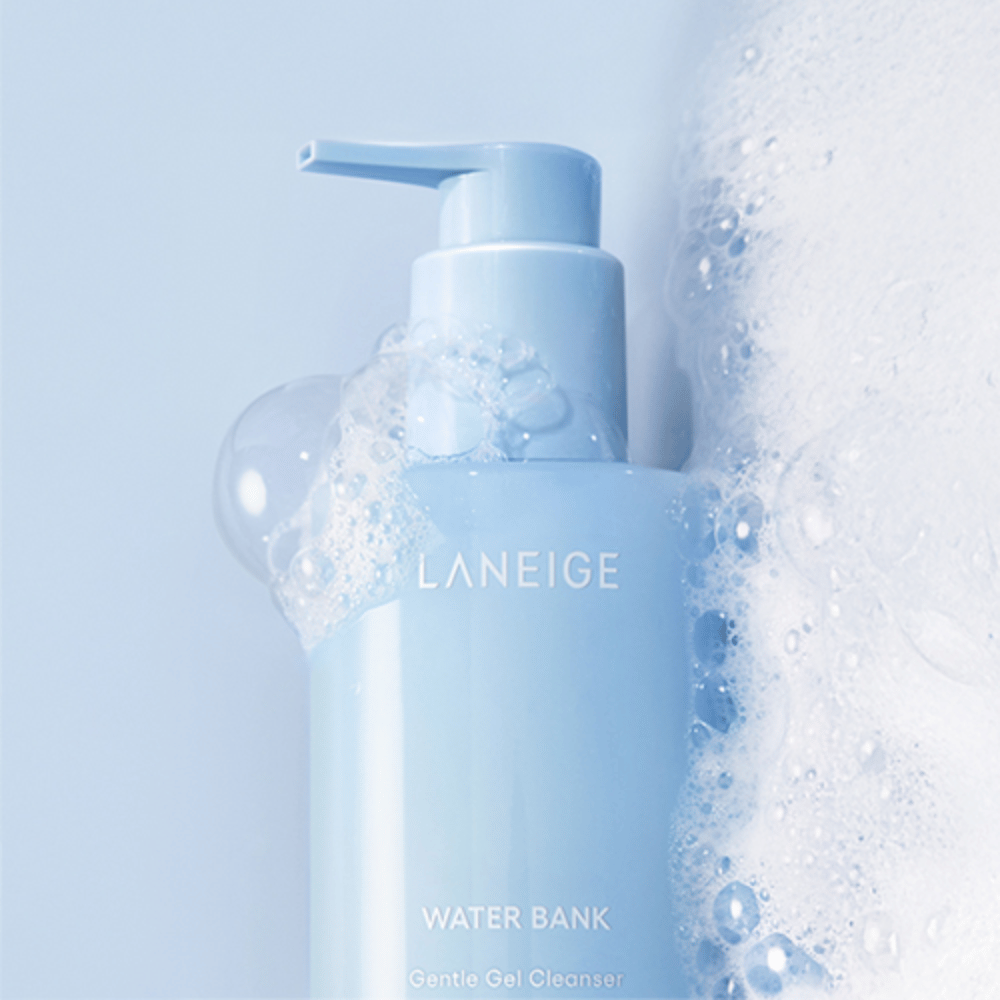 LANEIGE Water Bank Gentle Gel Cleanser covered with foam and bubbles against a light blue background, indicating cleanliness and freshness.